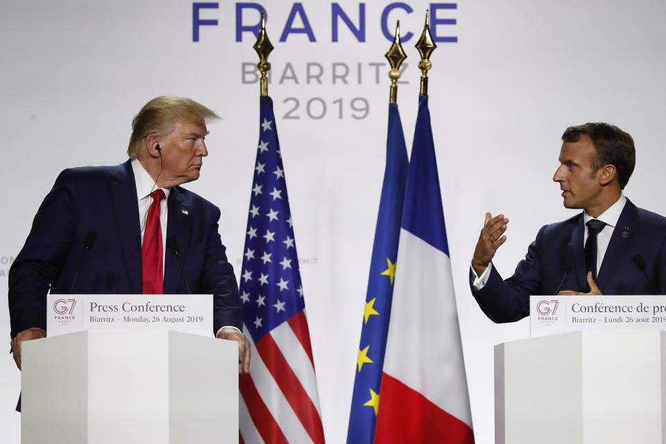 French President Emmanuel Macron, right, and U.S President Donald Trump attend the final press conference during the G7 summit Monday, Aug. 26, 2019 in Biarritz, southwestern France. (AP Photo/Francois Mori)