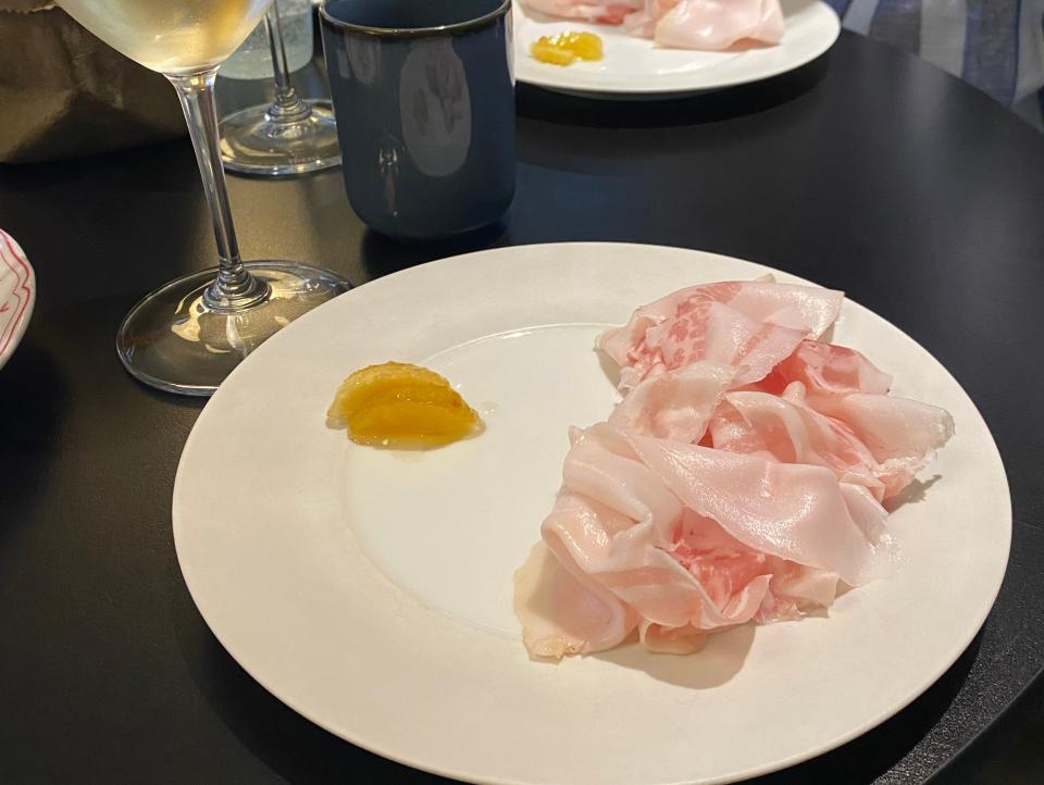 pancetta thrown on a white plate