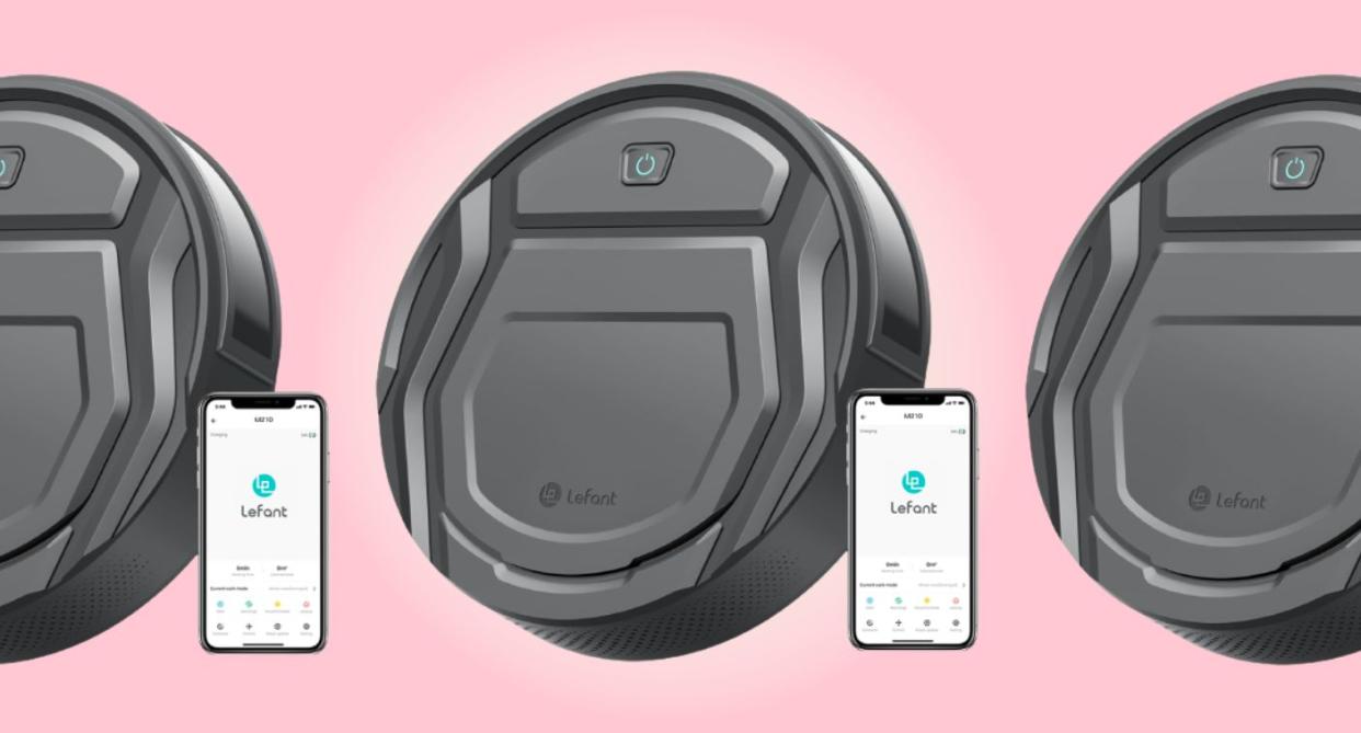 the amazon robot vacuum beside the app open on a phone