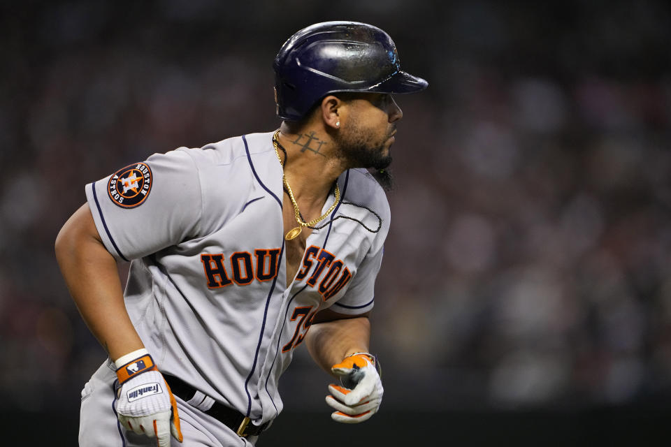 Houston Astros' Jose Abreu watches his two-run double take flight against the Arizona Diamondbacks during the sixth inning of a baseball game, Friday, Sept. 29, 2023, in Phoenix. (AP Photo/Matt York)