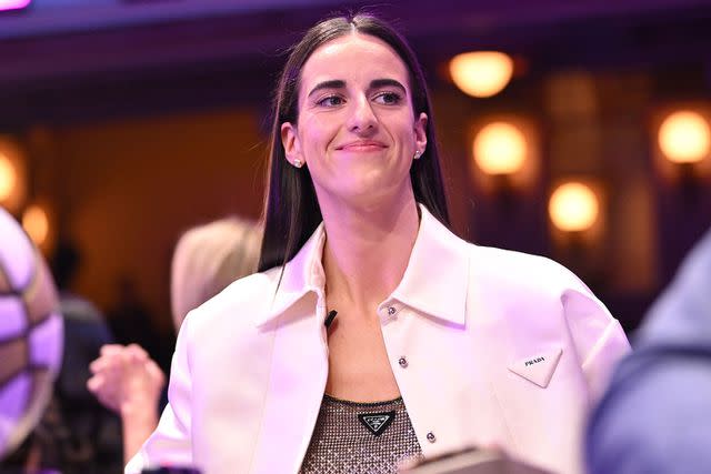 <p>Mike Lawrence/NBAE via Getty</p> Caitlin Clark smiles during the WNBA Draft