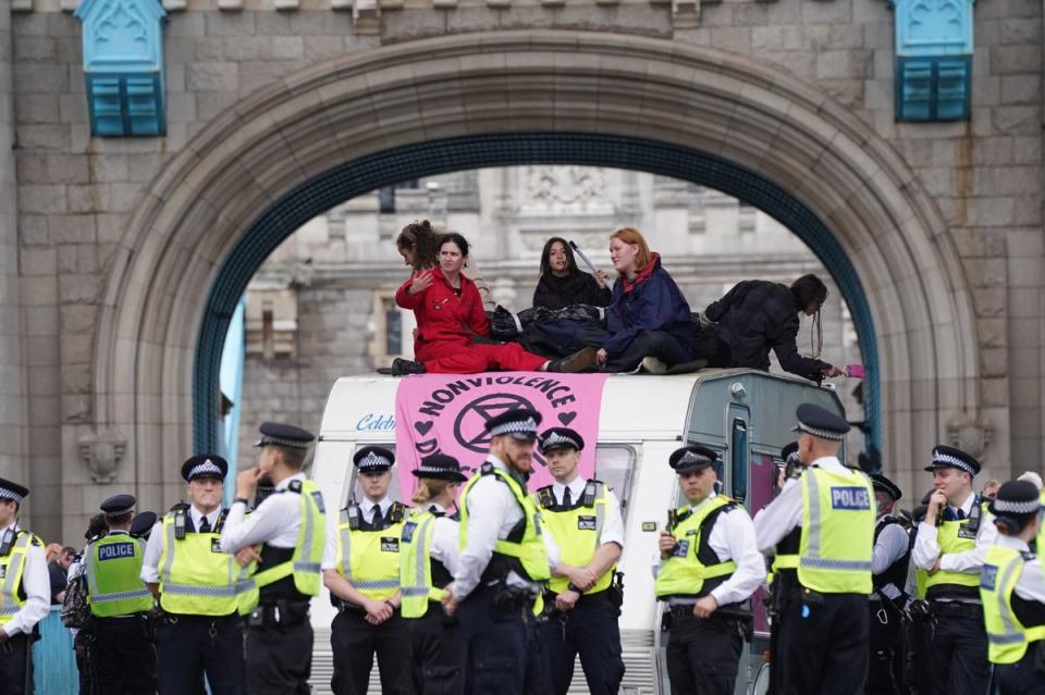 Police by a caravan on Tower Bridge, central London after members of Extinction Rebellion blocked the road (PA Wire)