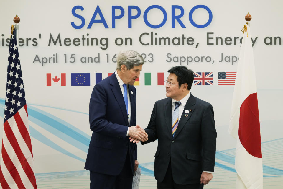 U.S. Special Presidential Envoy for Climate John Kerry and Japan's Environment Minister Akihiro Nishimura shake hands before their bilateral meeting in the G-7 ministers' meeting on climate, energy and environment in Sapporo, northern Japan, Saturday, April 15, 2023. (AP Photo/Hiro Komae)