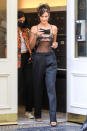 <p>Bella Hadid is all smiles as she's seen leaving her hotel in a sheer top on Friday in New York City. </p>