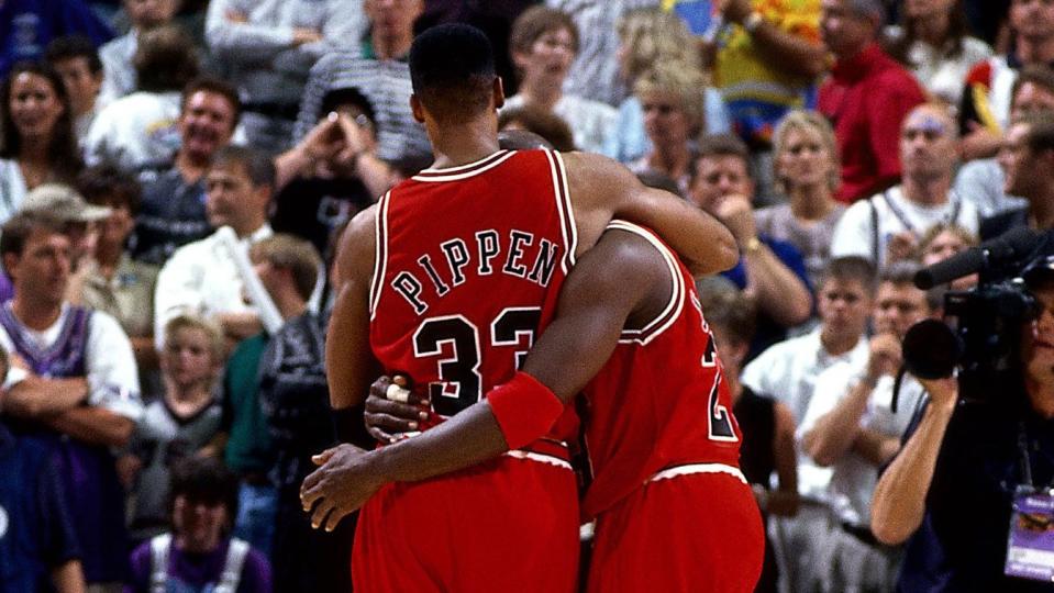 Scottie Pippen holding up Michael Jordan in the "Flu Game"—Game 5 of the '97 NBA Finals.