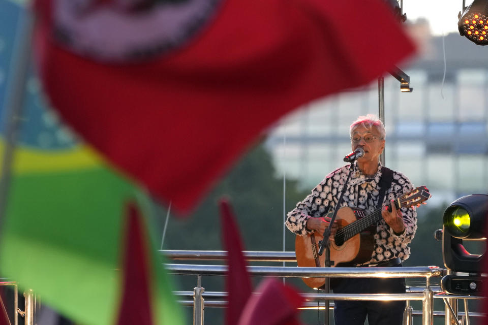 Singer Caetano Veloso sings during a demonstration by the "Act for the Earth" movement in front of the National Congress in Brasilia, Brazil, Wednesday, March 9, 2022. Hundreds of civil society organizations joined some of Brazil's most famous musicians in an attempt to prevent the passage of the so-called "poison bill" that would loosen restrictions on the use of pesticides, plus demand effective action to contain deforestation in the Amazon and mining on indigenous lands. (AP Photo/Eraldo Peres)