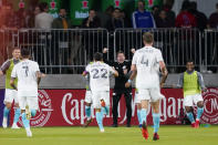 New England Revolution midfielder Carles Gil (22) celebrates his goal during the second half of an MLS soccer match against the D.C. United, Wednesday, Oct. 20, 2021, in Washington. The Revolution won 3-2. (AP Photo/Alex Brandon)