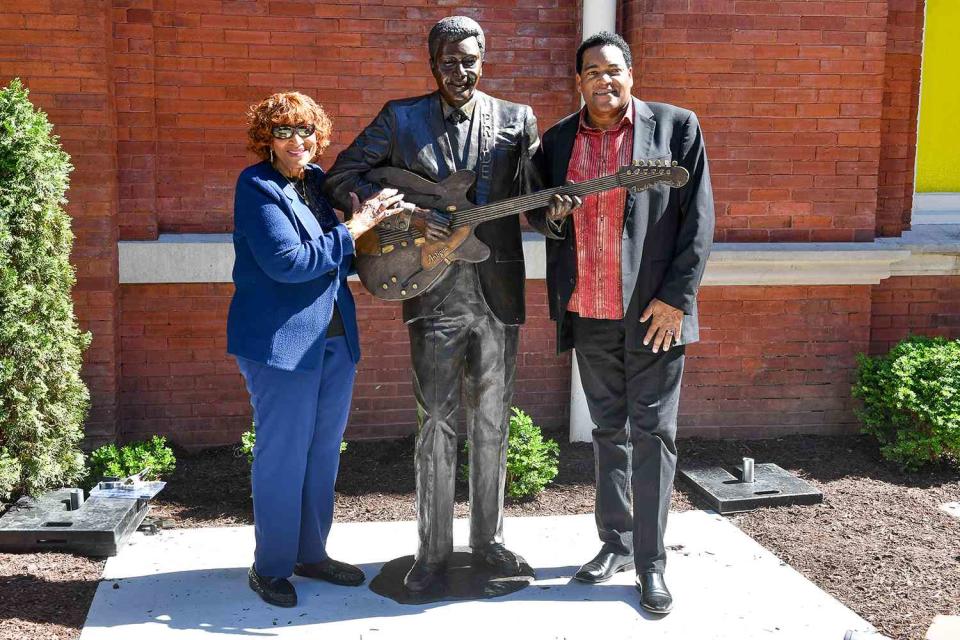 Jason Davis/Getty Images Rozene Cohran Pride and Dion Pride with Charley Pride statue 