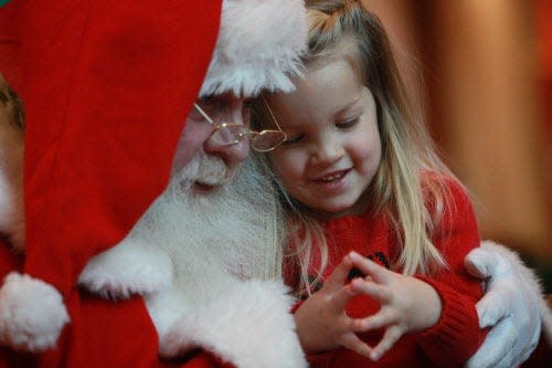 Jaylin Gillstrom of Hartland shares a special moment with Santa at Brookfield Square Mall in 2009.