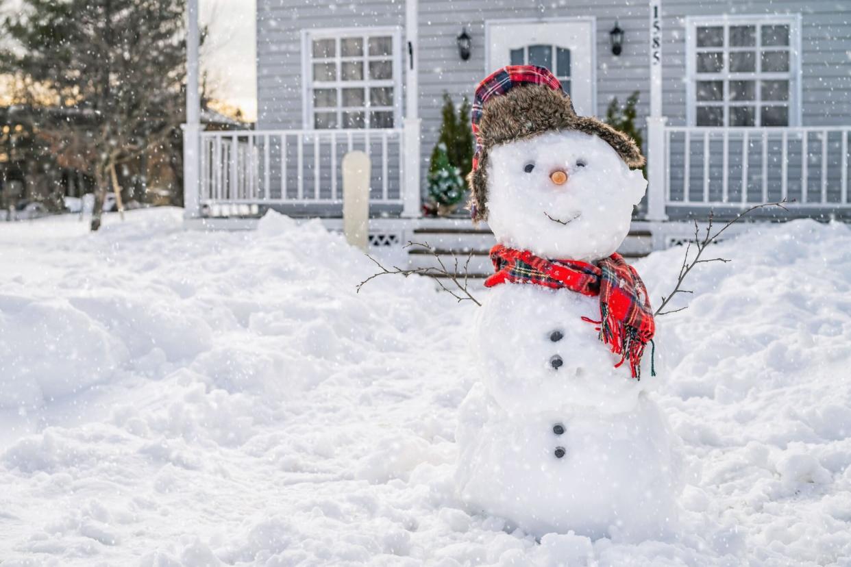 smiling snowman front yard