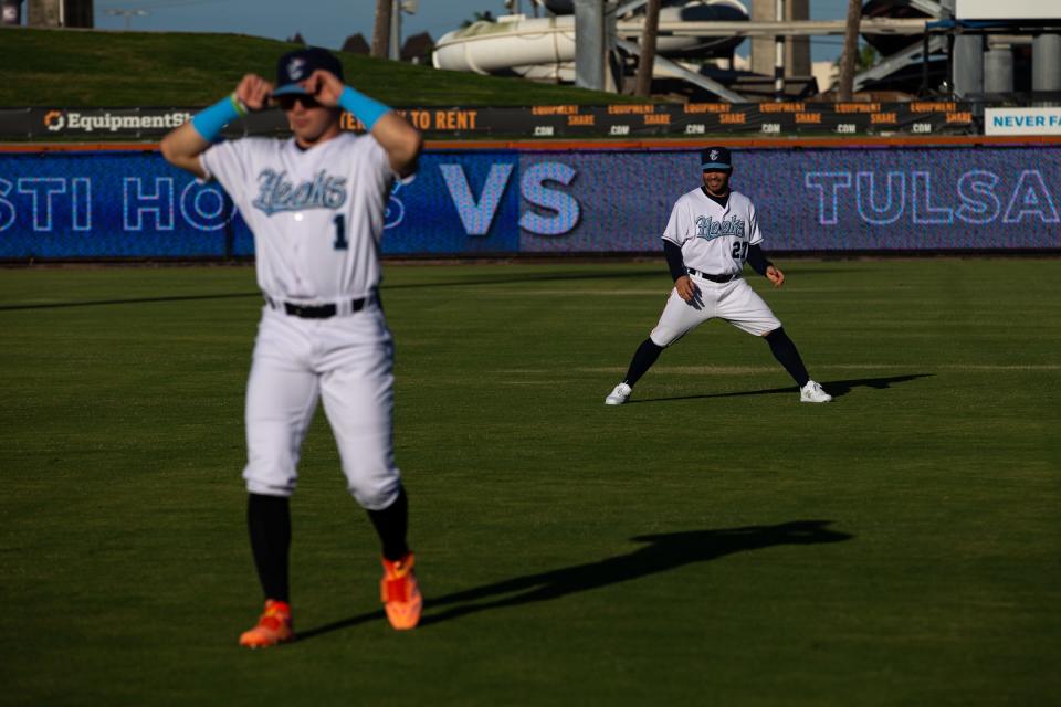 Astros' Jose Altuve, back, and Hooks' Drew Gilbert warm up before the game on Tuesday, May 16, 2023, at Whataburger Field in Corpus Christi, Texas.