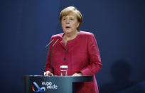 German Chancellor Angela Merkel gives a media statement after a video conference with mayors of German cities on the spread of the coronavirus disease, in Berlin, Germany, Oct. 9, 2020. (Axel Schmidt/Pool via AP)