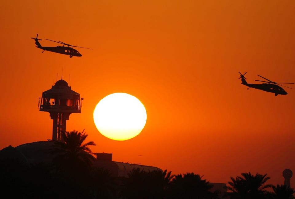 Black Hawk helicopters prepare to land in Baghdad's Green Zone