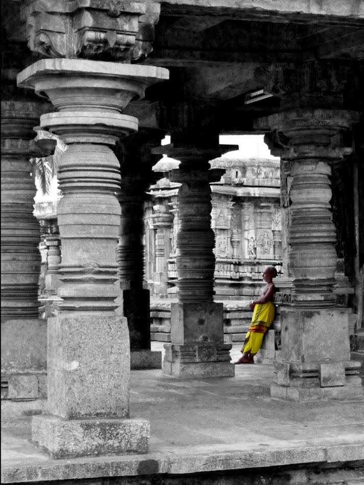 A priest in the temple precincts. Belur is among the few Hoysala temples where regular worship services are held.