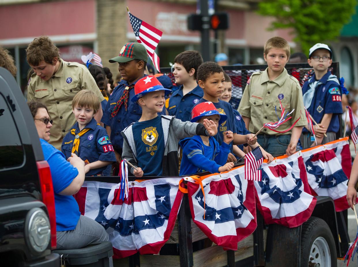 Cub Scouts participate participate in the Mishawaka Memorial Day Parade Monday, May 27, 2019, in downtown Mishawaka. The parade resumes on Monday after a four-year hiatus.