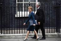 Nicola Sturgeon, First Minister of Scotland smiles as she arrives at Downing Street in London, Britain October 24, 2016. REUTERS/Dylan Martinez