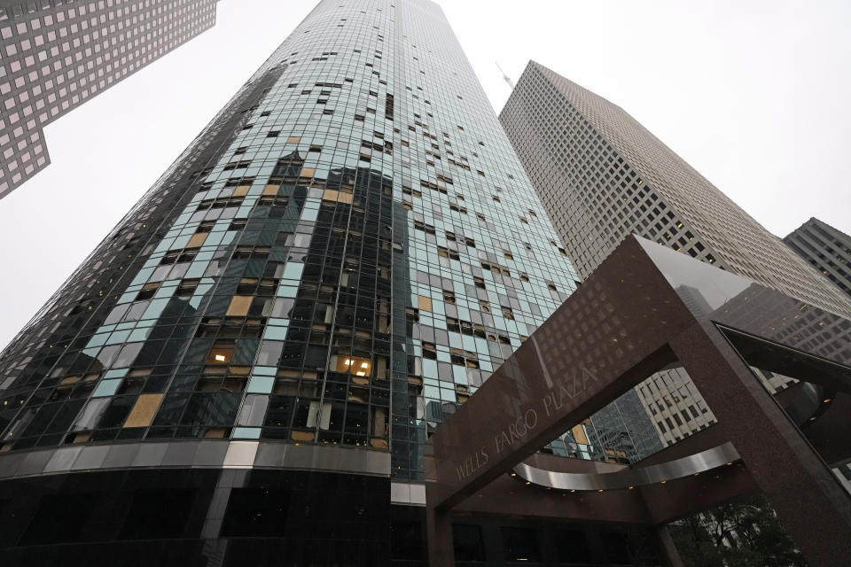 Blown out windows on a high-rise downtown building are shown in the aftermath of a severe thunderstorm Friday, May 17, 2024, in Houston. Thunderstorms pummeled southeastern Texas on Thursday killing at least four people, blowing out windows in high-rise buildings and knocking out power to more than 900,000 homes and businesses in the Houston area. (AP Photo/David J. Phillip)