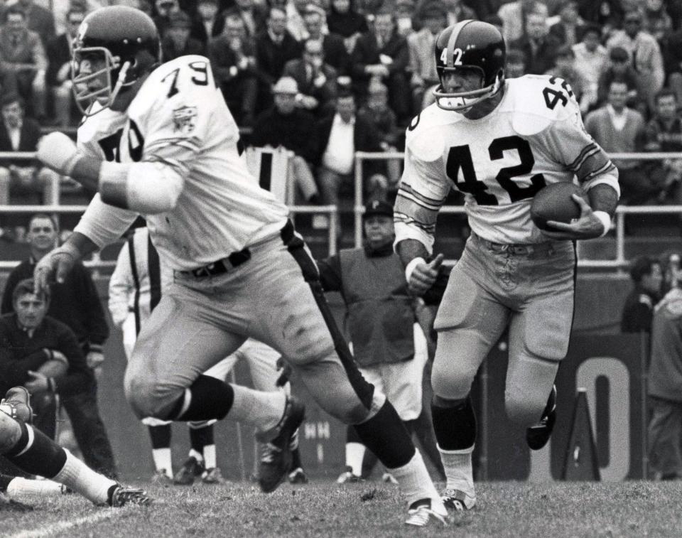 Oct 26, 1969; Pittsburgh, PA, USA; FILE PHOTO; Pittsburgh Steelers half back Dick Hoak (42) runs the ball with guard Larry Gagner (79) against the Washington Redskins at Pitt Stadium. Hoak rushed for 858 yards on 175 carries for the 1969 season.  Mandatory Credit: Malcolm Emmons- USA TODAY Sports