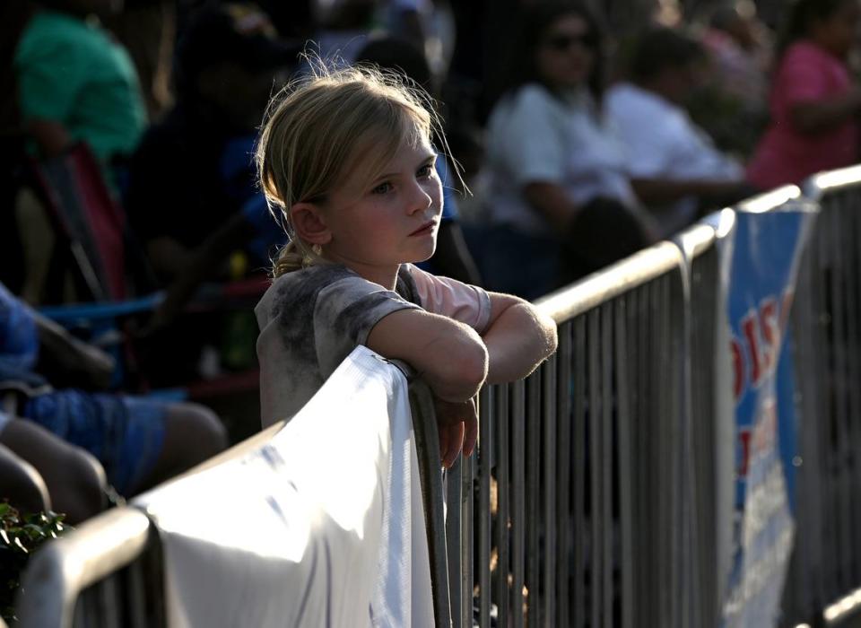 A young girl watches the DeSoto Parade on Saturday, April 27, 2024.