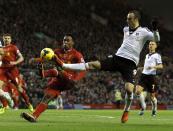 Liverpool's Daniel Sturridge (L) challenges Fulham's Dimitar Berbatov during their English Premier League soccer match at Anfield in Liverpool, northern England November 9, 2013.