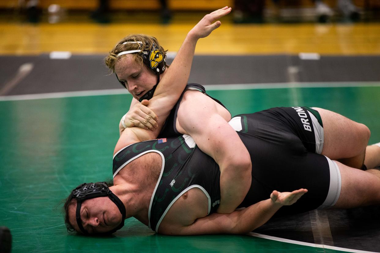 Hamilton's Shane Dams wrestles with Coopersville boys wreslting Wednesday, Jan. 25, 2023, at Coopersville High School. 