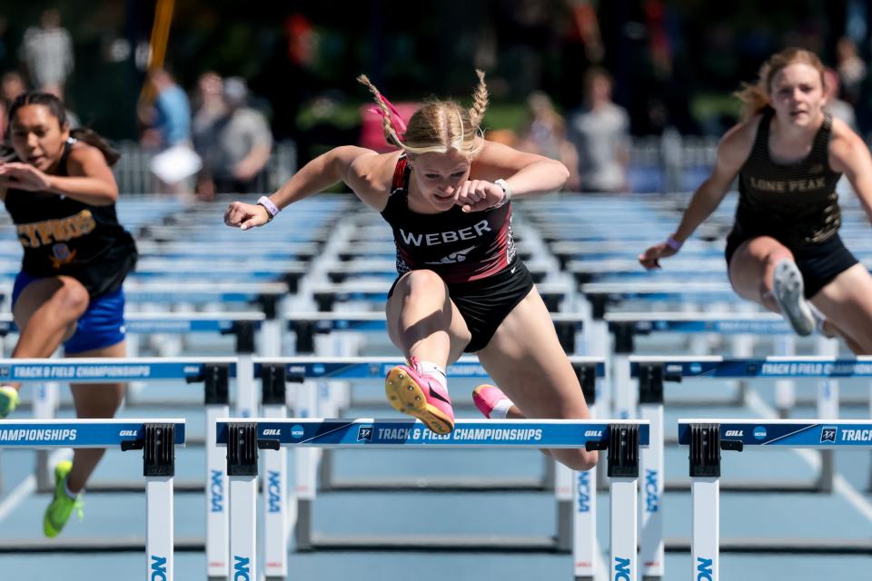 Weber’s Eden DeVries places first in heat 3 of the 6A girls 100-meter hurdles at the Utah high school track and field championships at BYU in Provo on Thursday, May 18, 2023. | Spenser Heaps, Deseret News