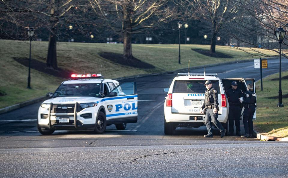 Police block the entrance to an office park on King Street in Armonk on Jan. 20, 2023 near where a small plane crashed a mile from  Westchester County Airport on Thursday evening. Two people died in the crash.