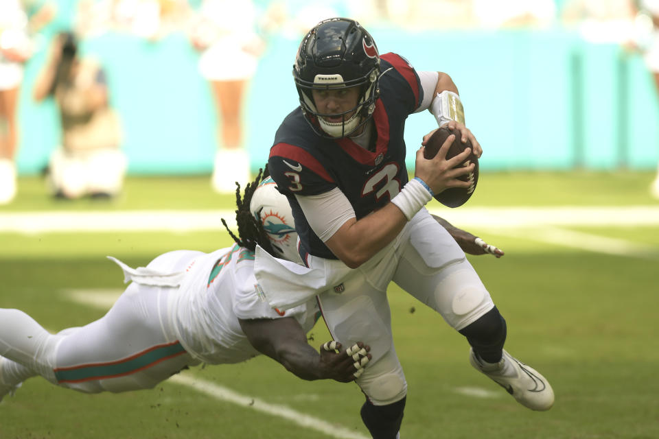 Miami Dolphins linebacker Melvin Ingram (6) sacks Houston Texans quarterback Kyle Allen (3) during the first half of an NFL football game, Sunday, Nov. 27, 2022, in Miami Gardens, Fla. (AP Photo/Michael Laughlin)