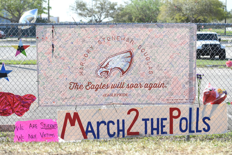 <p>Students visit memorial for Stoneman Douglas High School Shooting victims on Feb. 23, 2018 in Parkland, Fla. (Photo: mpi04/MediaPunch/IPX/AP) </p>