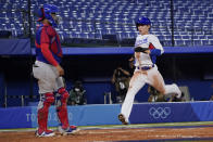 South Korea's Hyeseong Kim scores on a hit by Hae Min Park during the ninth inning of a baseball game against the Dominican Republic at the 2020 Summer Olympics, Sunday, Aug. 1, 2021, in Yokohama, Japan. (AP Photo/Sue Ogrocki)