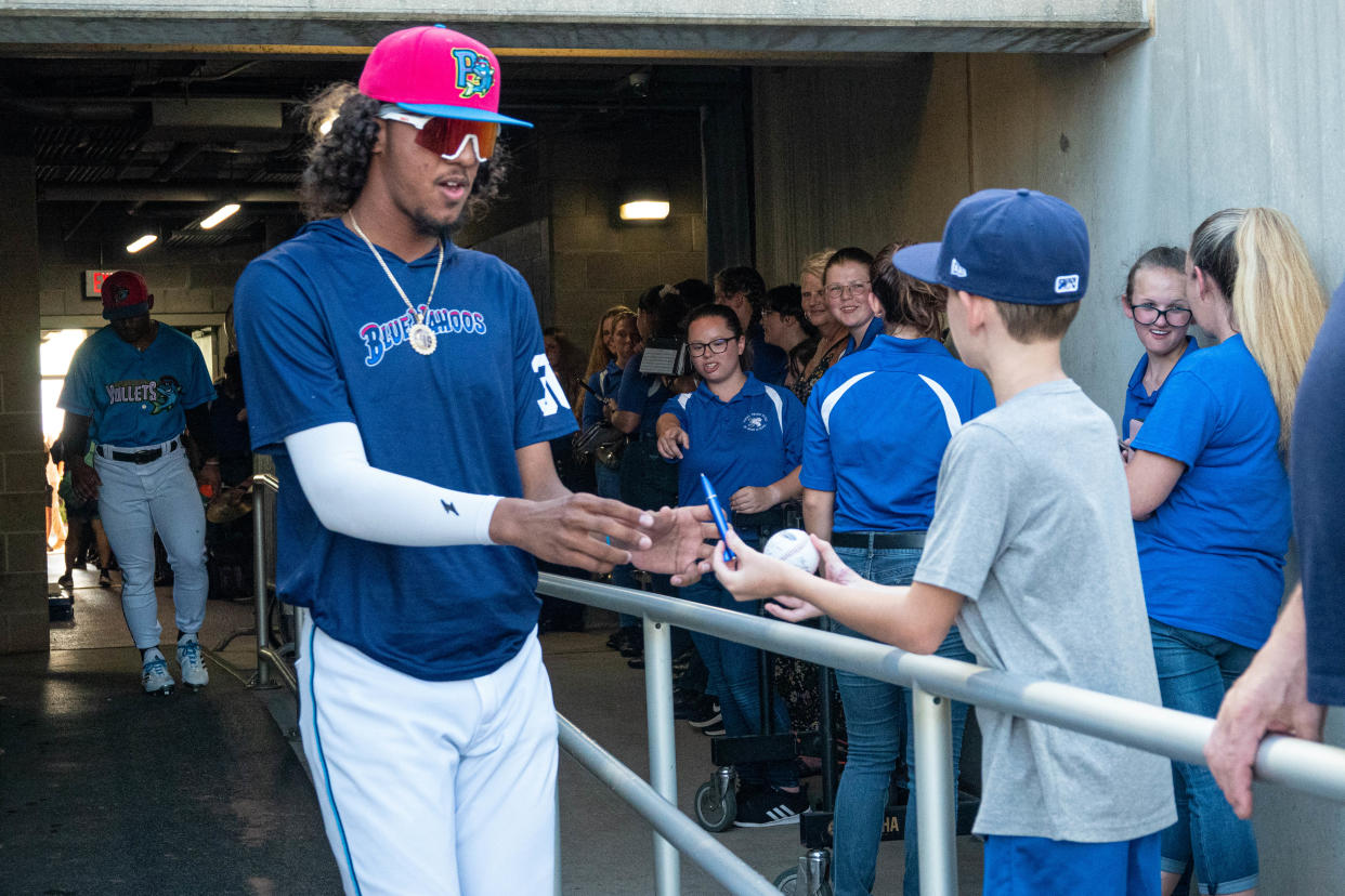 Eury Perez, shown signing autographs at a recent Blue Wahoos home game, was placed on injured last Saturday and has uncertain future the rest of the season following a tough outing against Montgomery last Friday.