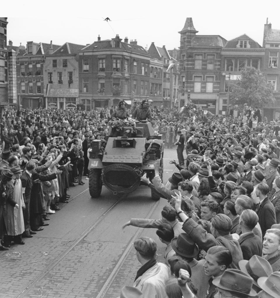 FILE - In this May 7, 1945 file photo a large crowd of Utrecht citizens gathers in the streets of the Dutch city to welcome the liberating Allied troops in their hometown. Nazi commanders signed their surrender to Allied forces in a French schoolhouse 75 years ago this week, ending World War II in Europe and the Holocaust. (AP Photo, File)