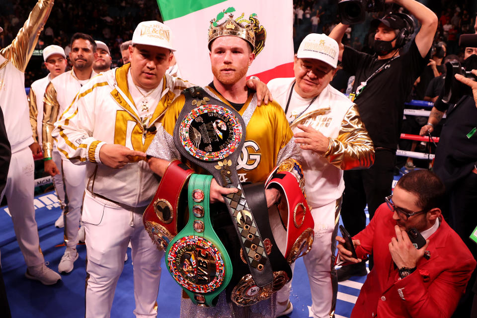 LAS VEGAS, NEVADA - NOVEMBER 06: Canelo Alvarez poses with the belts after his championship bout for Alvarez's WBC, WBO and WBA super middleweight titles and Plant's IBF super middleweight title at MGM Grand Garden Arena on November 06, 2021 in Las Vegas, Nevada. (Photo by Al Bello/Getty Images)