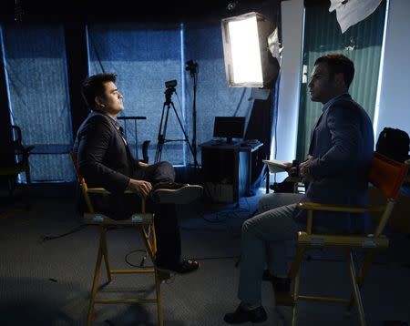 Journalist and director of film "Documented", Jose Antonio Vargas (L), poses for a photograph in Los Angeles, Californa June 18, 2014. REUTERS/Kevork Djansezian