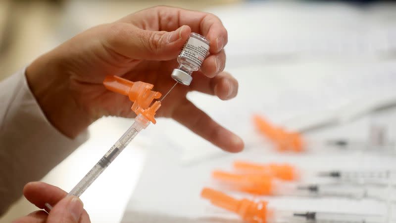 A Salt Lake County Health Department employee prepares Pfizer COVID-19 booster shots at a free vaccine clinic at the Sanderson Community Center in Taylorsville on Nov. 9, 2022. Updated COVID-19 boosters shots could be available in fall 2023.