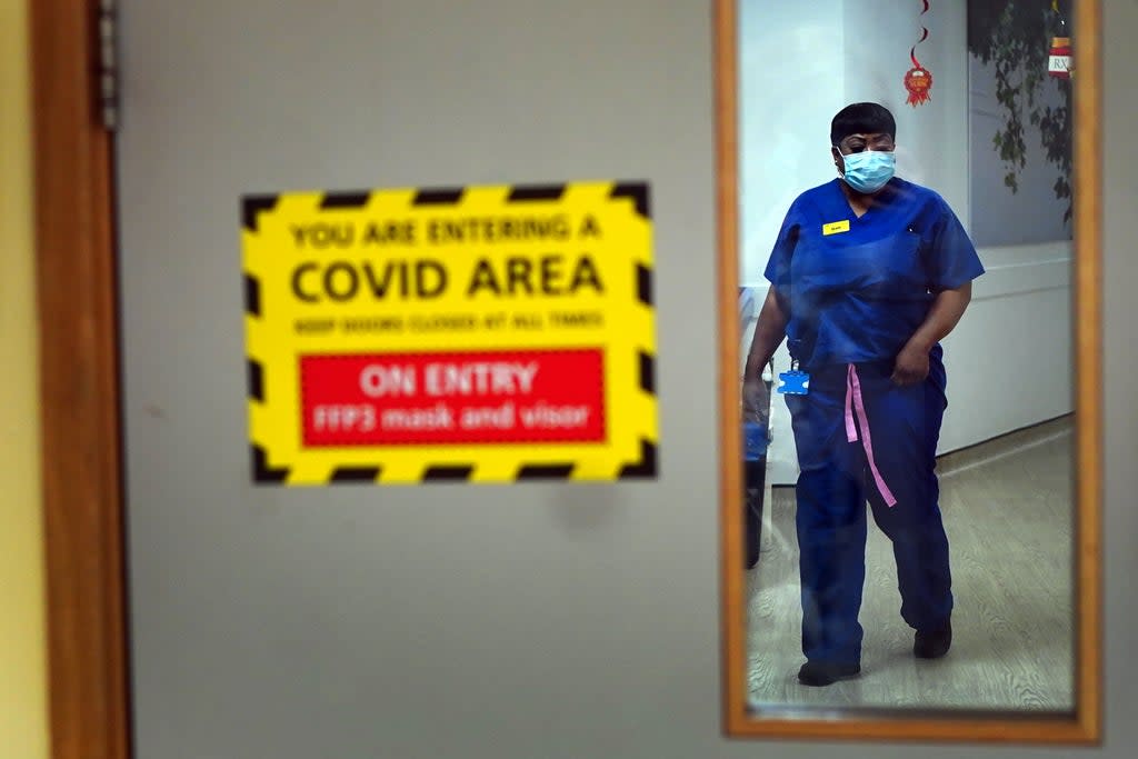 A nurse walks through a Covid ward at King’s College Hospital, London (PA) (PA Wire)