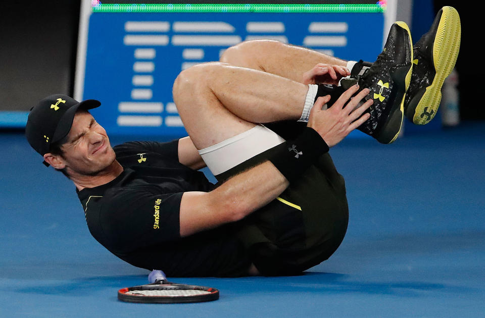 Britain’s Andy Murray falls during the Australian Open