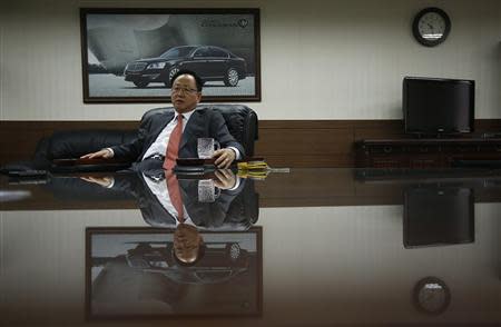 Lee Yoo-il, President and CEO of Ssangyong Motor Co, speaks during an interview with Reuters at his office in Seoul December 10, 2013. REUTERS/Kim Hong-Ji