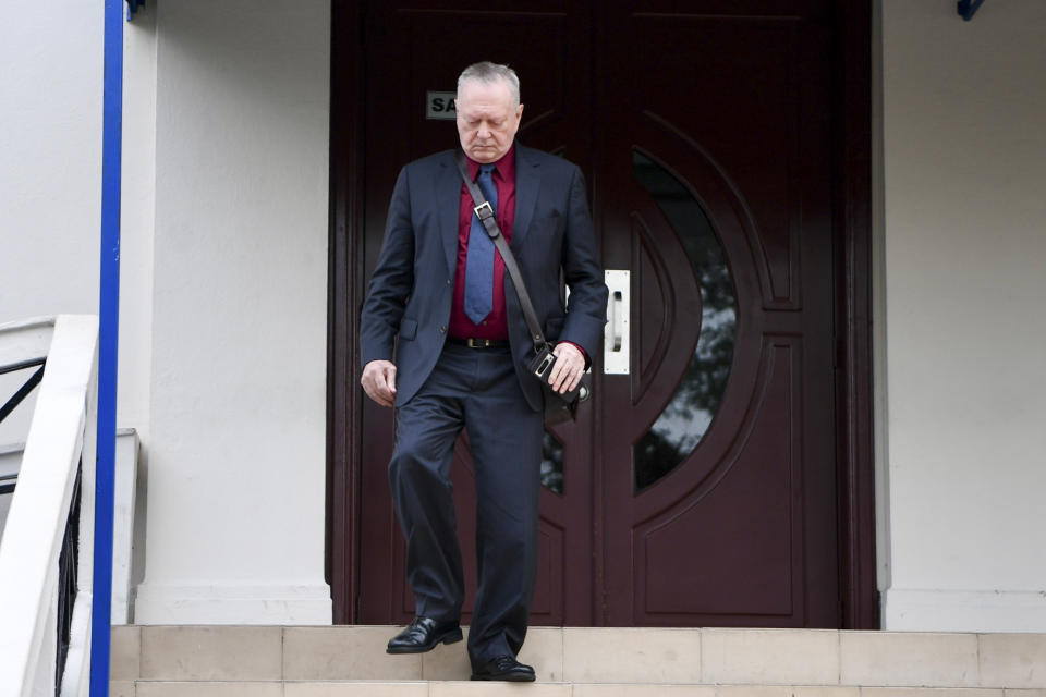 Juergen Mossack, partner of the law firm Mossack-Fonseca, leaves the Supreme Court during the trial of the "Panama Papers" money laundering case in Panama City, Monday, April 8, 2024. (AP Photo/Agustin Herrera)