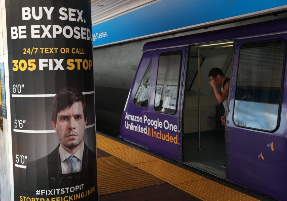 MIAMI, FLORIDA – NOVEMBER 06: Posters urging people to report sex trafficking are seen at a metromover rail stop on November 06, 2019 in Miami, Florida. The posters and other forms of media including a Metromover rail car wrap is part of a campaign by local, state, and federal agencies and partners to combat sex trafficking leading up to and beyond Super Bowl LIV. (Photo by Joe Raedle/Getty Images)