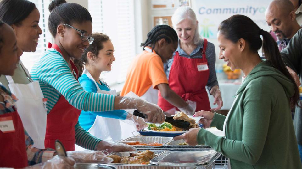 Volunteers serve food