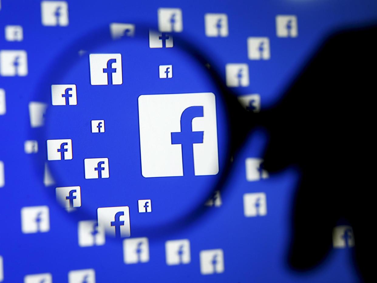 2015A man poses with a magnifier in front of a Facebook logo on display in this illustration taken in Sarajevo, Bosnia and Herzegovina, December 16, 2015: REUTERS/Dado Ruvic