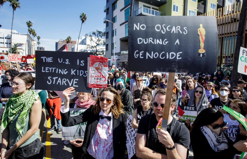 Demonstrators are seen near Hollywood's Dolby Theatre as the 96th Academy Awards are underway.