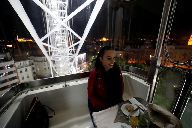 Hajnalka Lutor enjoys her meal as Michelin-starred restaurant Costes moves into the Budapest Eye ferris wheel during the coronavirus outbreak