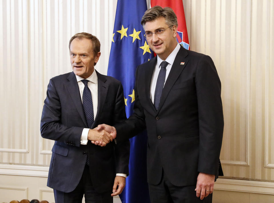 President of the European Council Donald Tusk, left, is welcomed by Croatia's prime minister Andrej Plenkovic in Zagreb, Croatia, Tuesday, Nov. 19, 2019. Donald Tusk attends the European Peoples Party (EPP) congress in Zagreb. (AP Photo/Darko Bandic)