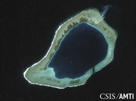 Subi Reef is shown in this handout satellite image dated August 8, 2012 and provided by CSIS Asia Maritime Transparency Initiative/Digital Globe September 14, 2015. REUTERS/CSIS Asia Maritime Transparency Initiative/Digital Globe/Handout via Reuters