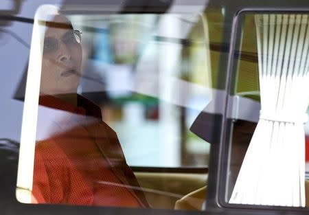 Thailand's King Bhumibol Adulyadej sits in a vehicle as he leaves Siriraj Hospital in Bangkok, Thailand, May 10, 2015. REUTERS/Chaiwat Subprasom