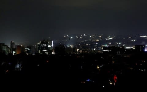 A view of Caracas during the blackout - Credit: Reuters