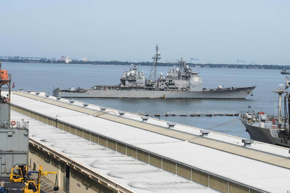 This image provided by the US Navy shows the USS San Jacinto (CG-56) as it heads out of the it's berth at Naval Station Norfolk ahead of Hurricane Dorian in Norfolk, Va., Wednesday Sept. 4, 2019. The U.S. Navy has ordered ships based on Virginia's coast to head out to sea to avoid Hurricane Dorian. (Alton Dunham/US Navy via AP)
