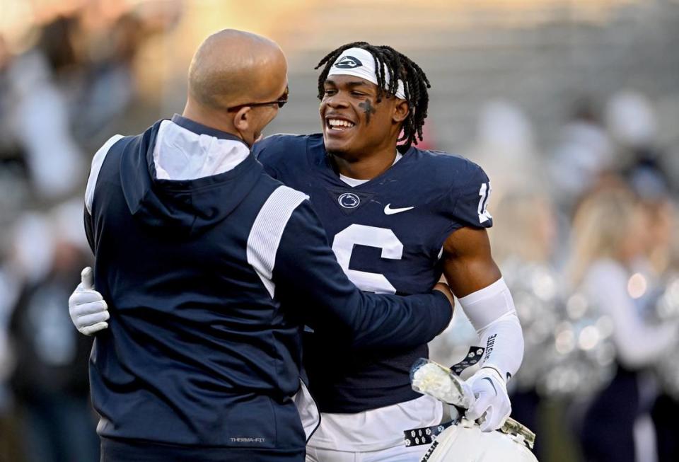 Penn State football coach James Franklin hugs senior Ji’Ayir Brown before the game against Michigan State on Saturday, Nov. 26, 2022.